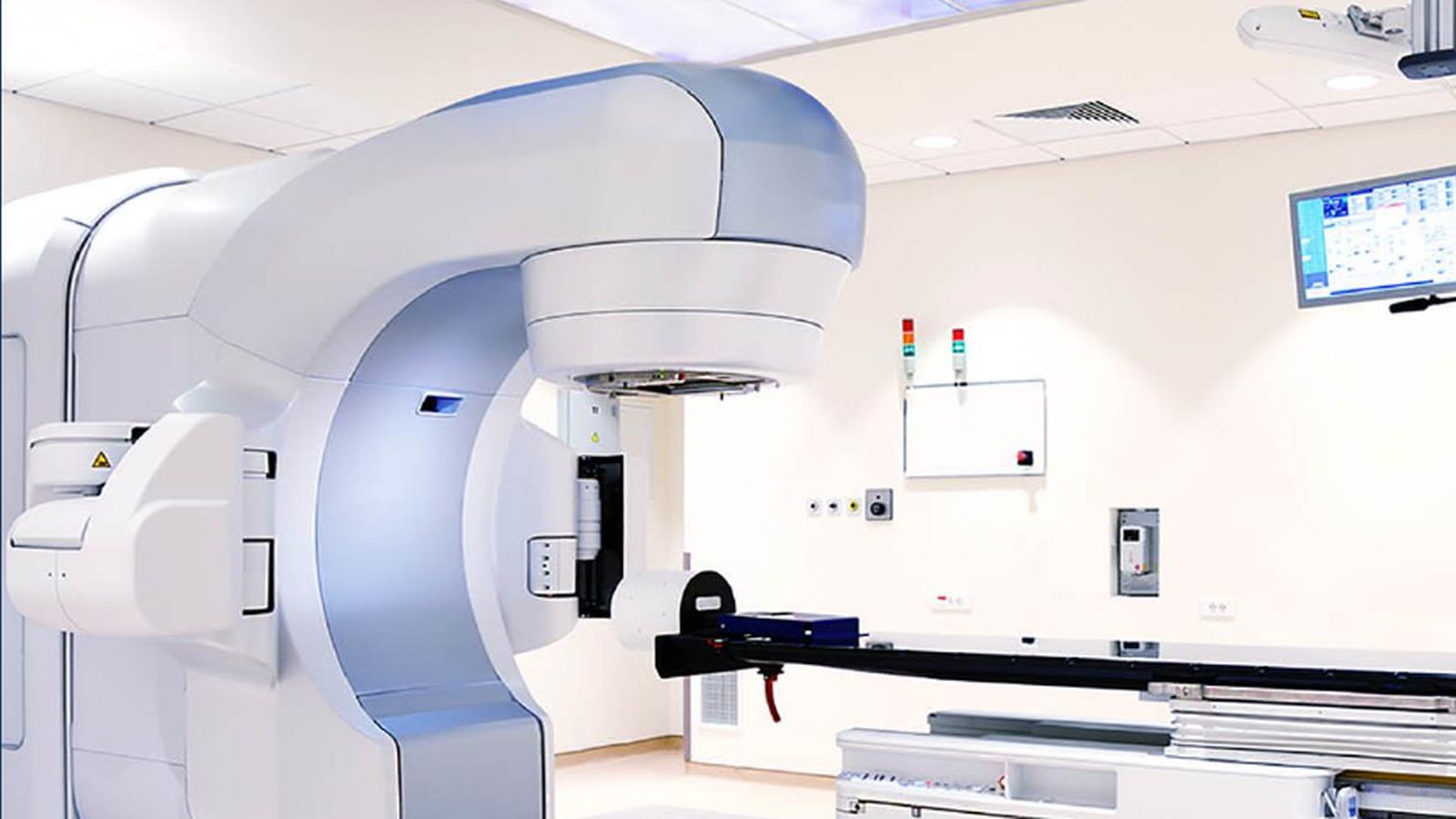 Advanced medical equipment inside a clinical treatment room.